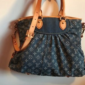 Louis Vuitton purse with soft leather inside.